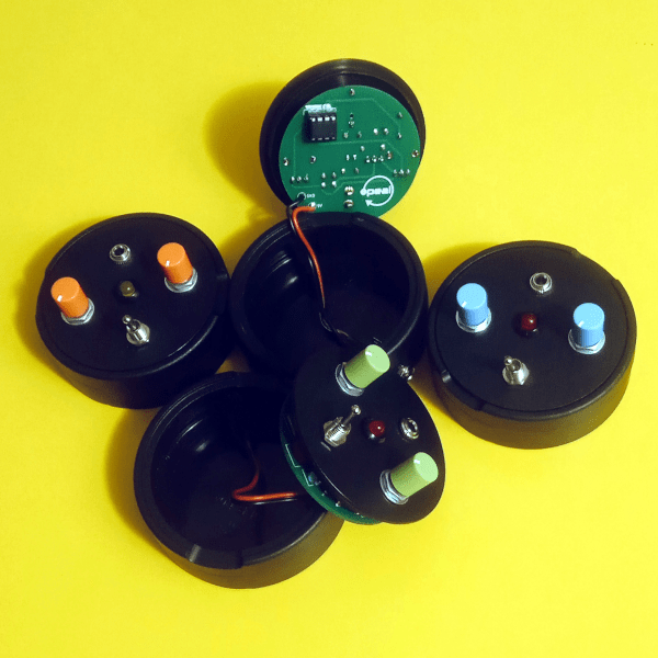 a picture of black boxes containing electronic circuits